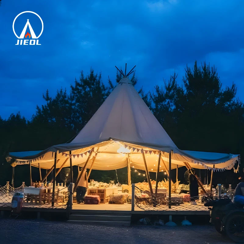 Illuminated Tipi tent with open sides at night